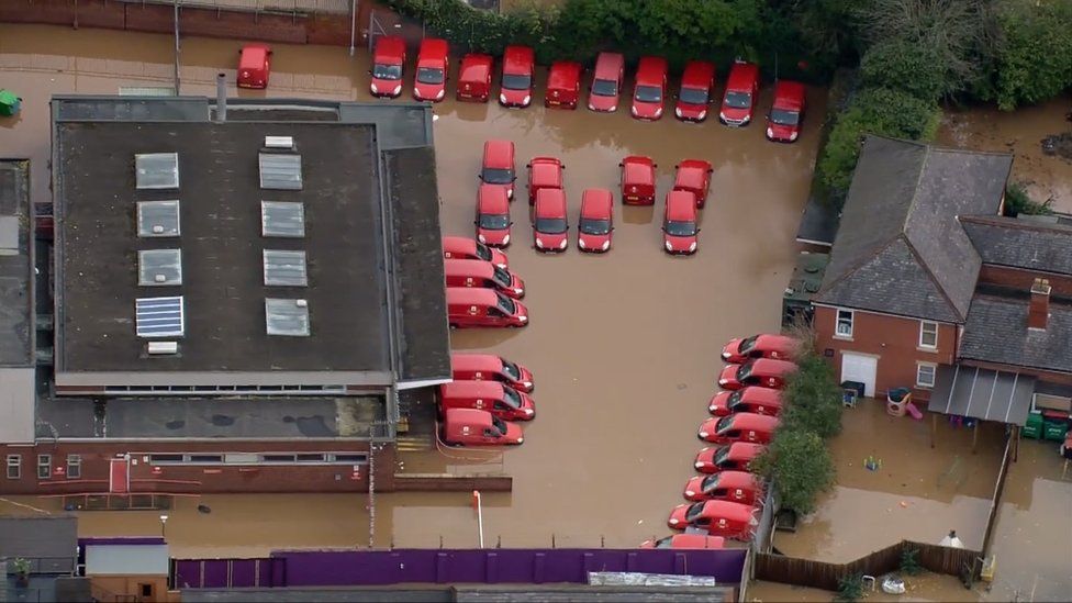 Royal Mail vans in flood water
