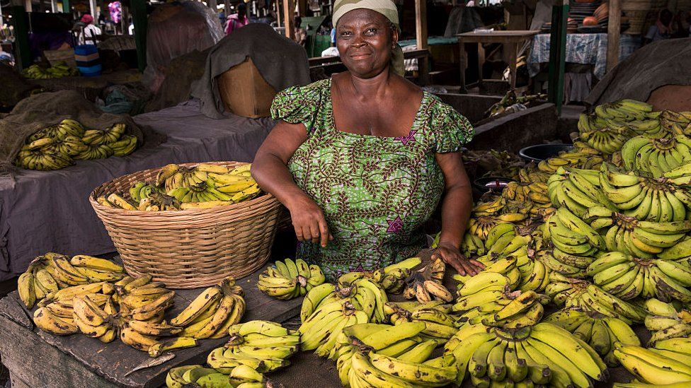 Informal worker Rebecca Paintsil selling bananas at Kantamanto market August 10, 2015 in Accra