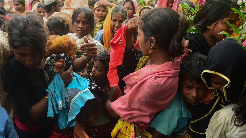 Newly arrived Rohingya refugees struggle for relief materials at Kutupalong refugee camp in Bangladesh's Ukhiya district on September 9, 2017