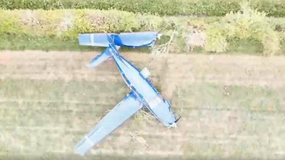 Crashed plane in field