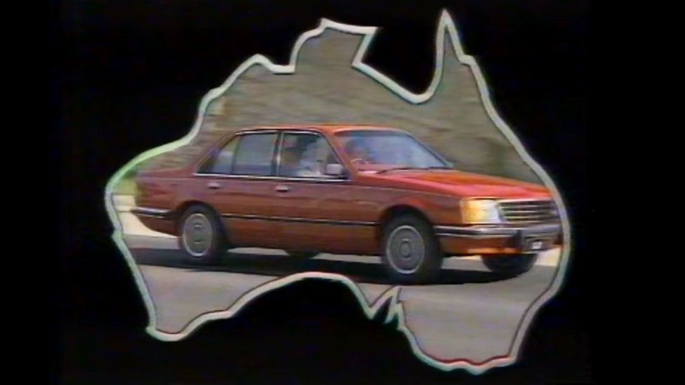 A image from a 1970s advert showing a Holden car inside a map of Australia