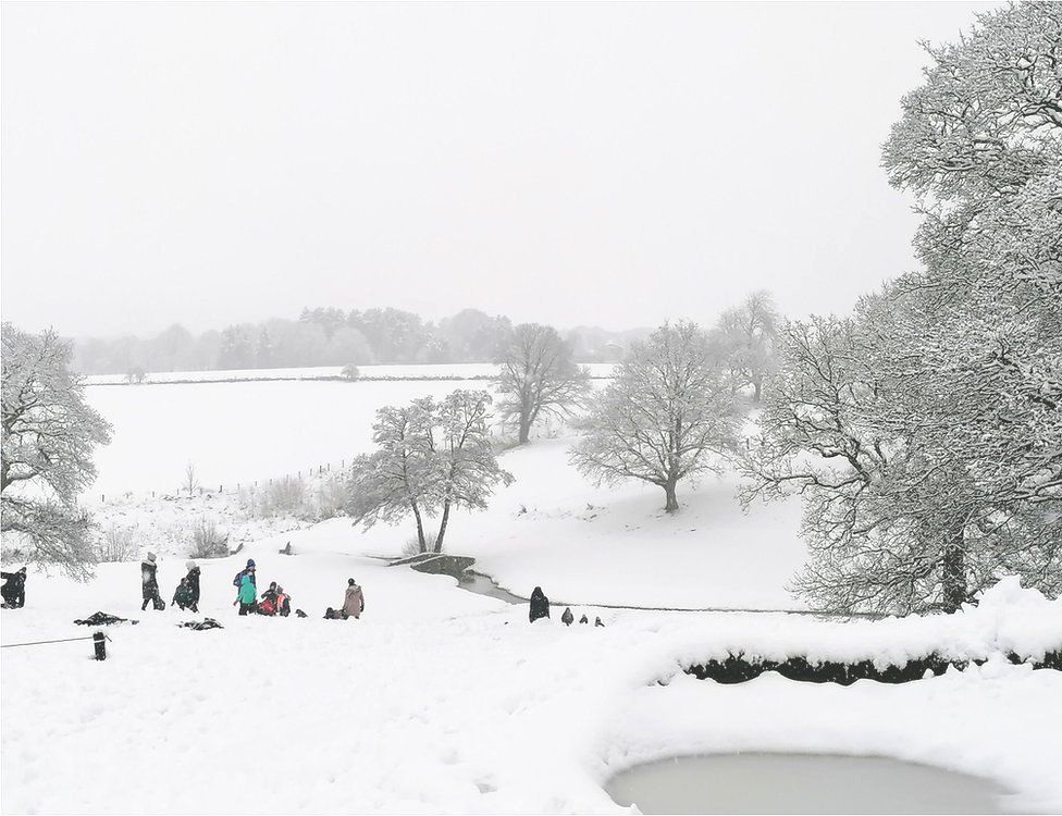 People in the snow in Adel, Leeds
