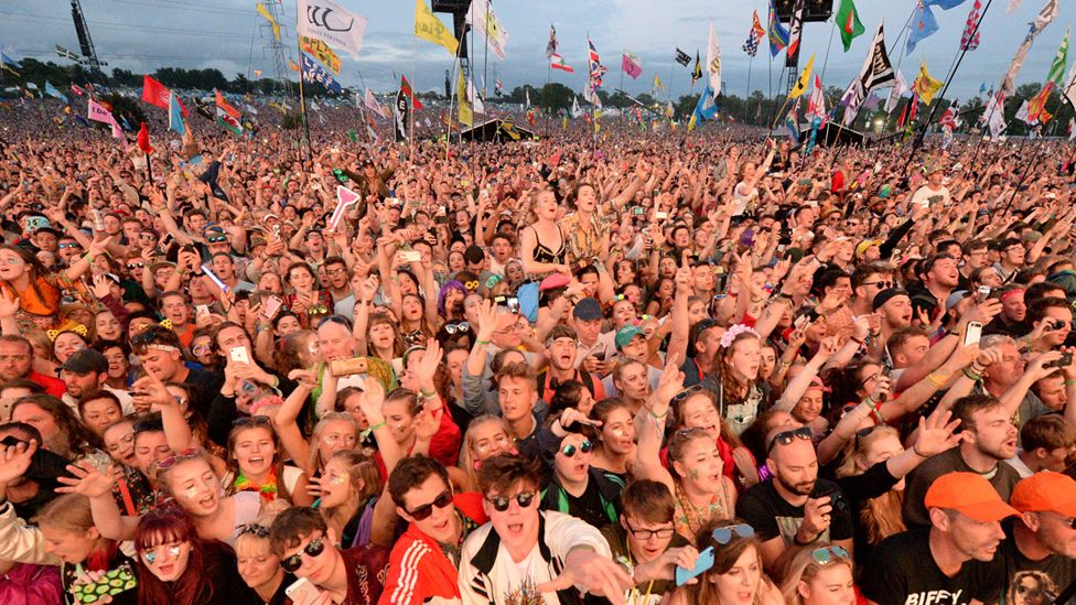 Festivalgoers watch the Pyramid Stage at Glastonbury Festival - 2017