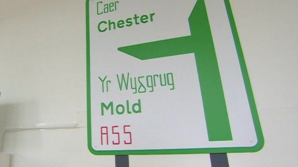 A road sign showing the proposed spelling for Mold