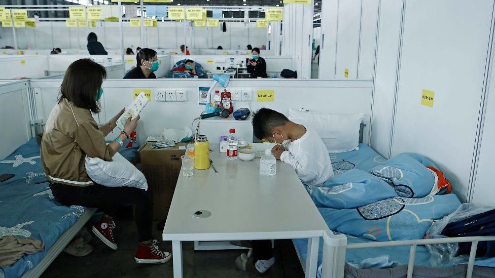 A mother and child in a quarantine zone at makeshift hospital in Shanghai this year