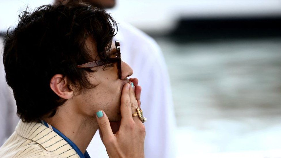 Harry Styles blows a kiss to fans at the Venice Film Festival