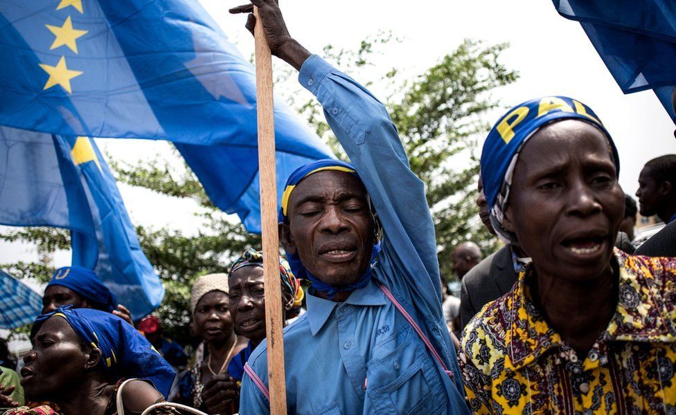 Supporters of the current President of the Democratic Republic of the Congo sing and dance during celebrations marking the 17th anniversary of the president's father and former president Laurent-Desire Kabila's assassination, on January, 16, 2018 in Kinshasa.