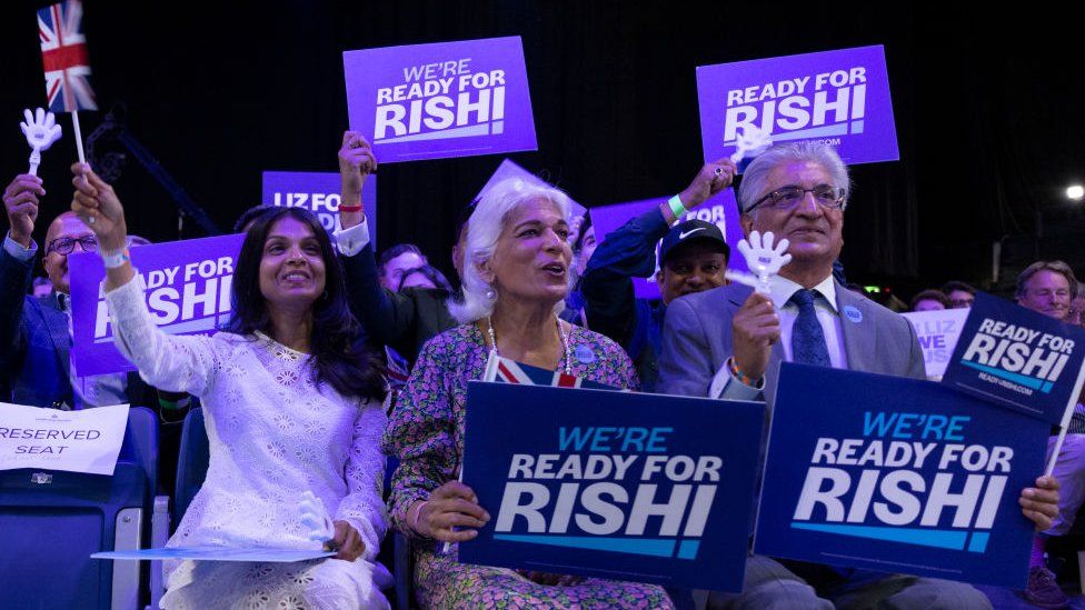 Akshata Murty with Rishi Sunak's parents at a leadership hustings in August