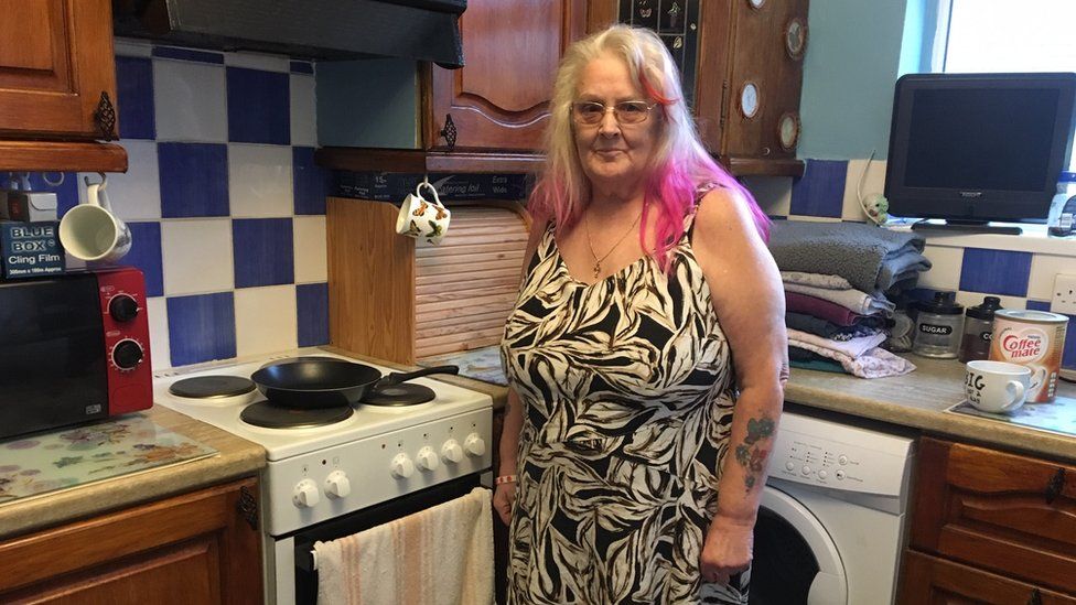 Glenda Kenyon by her kitchen hob