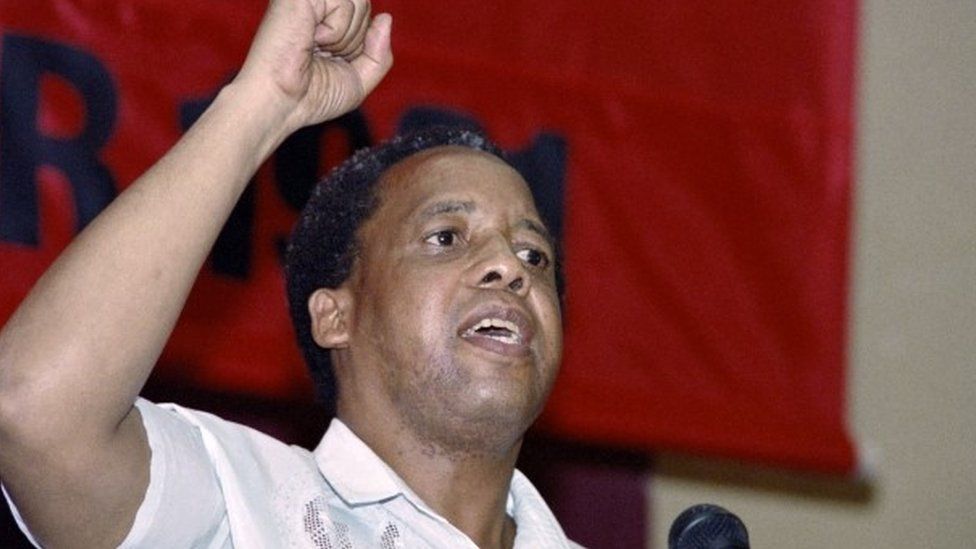 Chris Hani salutes delegates at the closure of their first congress inside South Africa in 41 years, in Soweto on 8 December 1991