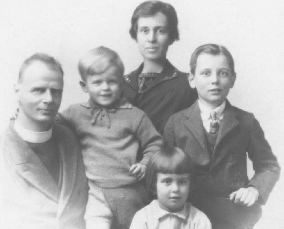 A black and white picture showing the Reverend Hubert Warren with his wife and three of his children