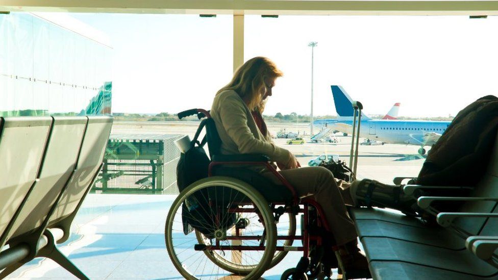 wheelchair user in departure lounge