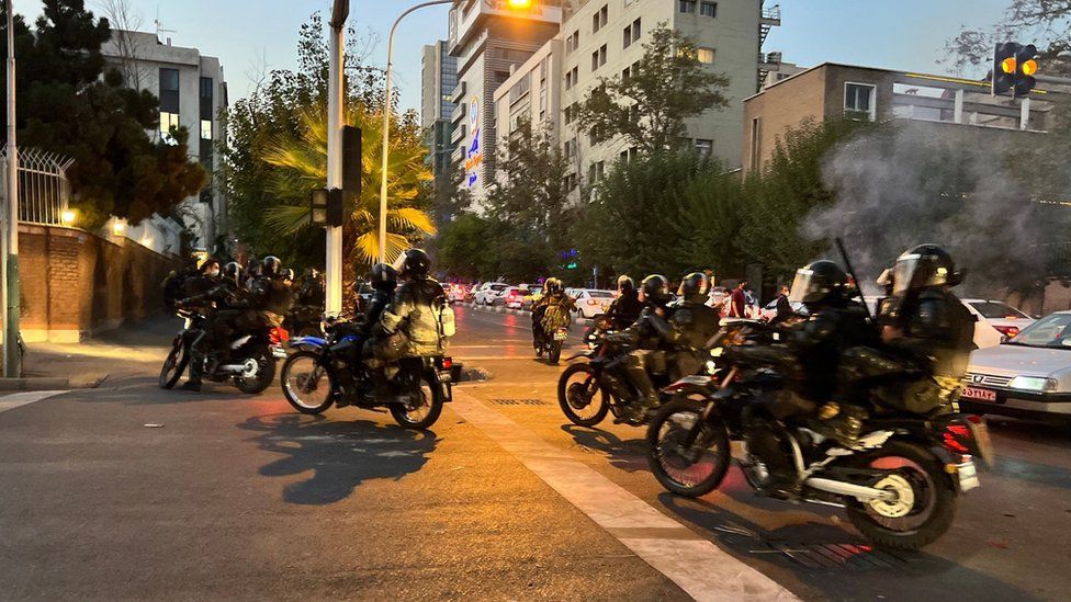 File photo showing Iranian riot police riding motorcycles during a protest in Tehran, Iran (19 September 2022)