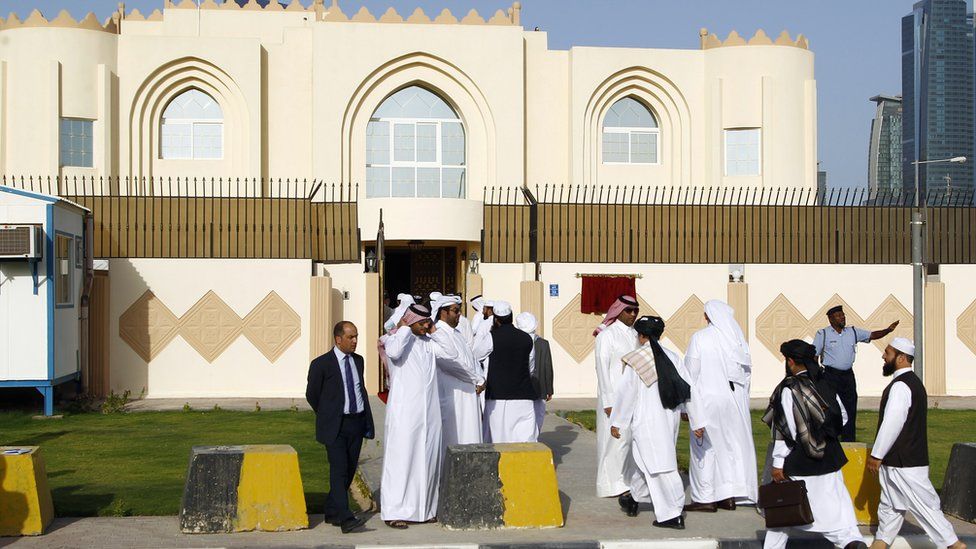 Guests arrive for the opening ceremony of the new Taliban political office in Doha on June 18, 2013