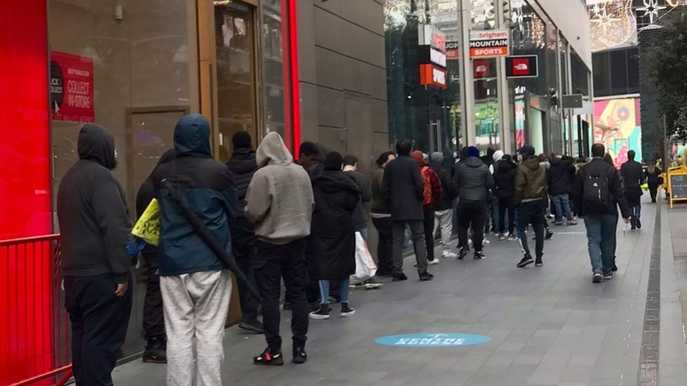 Customers queue for click and collect at Westfield in Stratford, east London