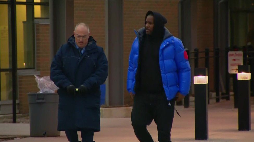 R Kelly is seen with his lawyer after posting his $100,000 bail.