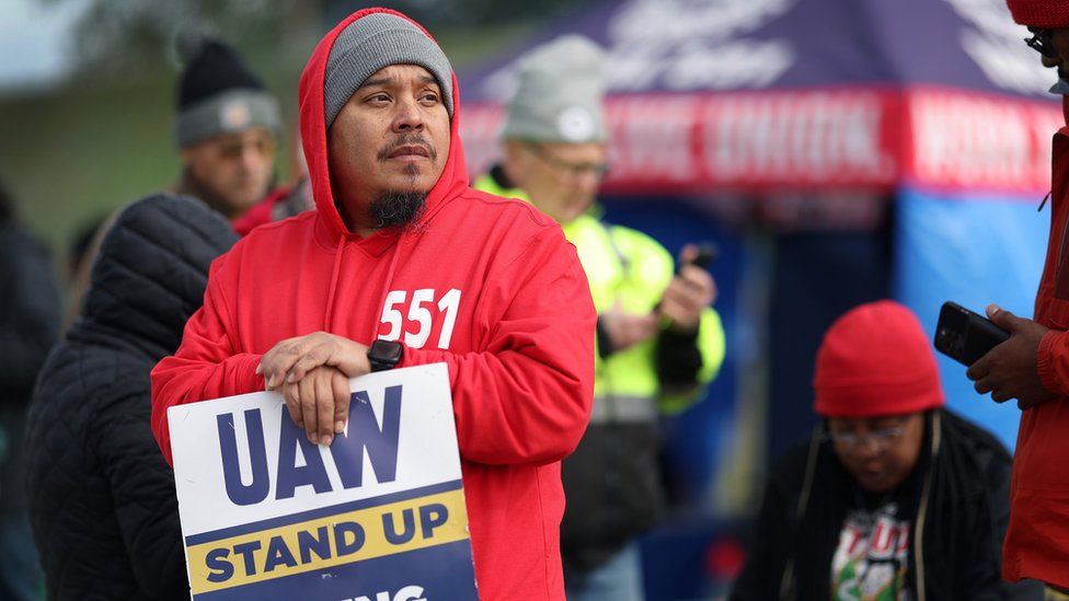 Workers picket outside of the Ford Assembly plant in Chicago, Illinois.