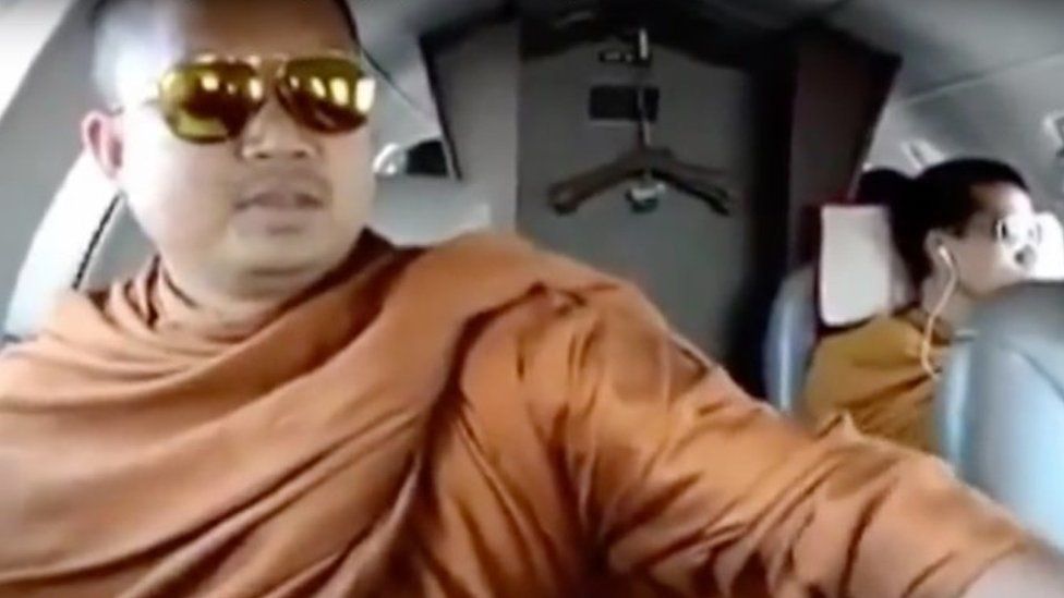 Nen Kham was seen riding in a private airplane in a video released in 2013