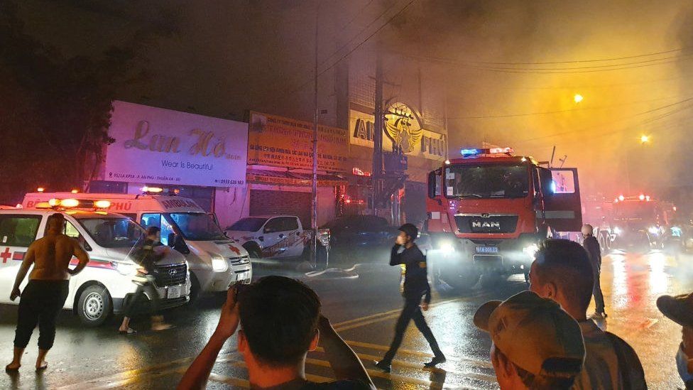 Firefighters at the scene of a deadly fire that engulfed a karaoke bar in Binh Duong province, north of Ho Chi Minh City