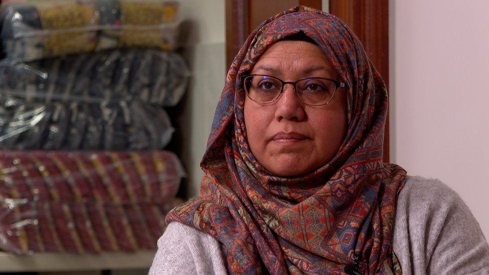 Sufia Alam pictured sitting down, wearing a red patterned hijab