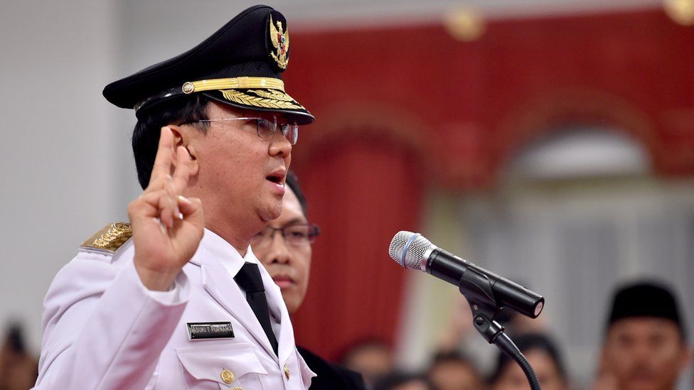 Basuki Tjahaja Purnama, also known as Ahok, gestures as he is sworn-in as Jakarta's new governor at the Palace in Jakarta on November 19, 2014.