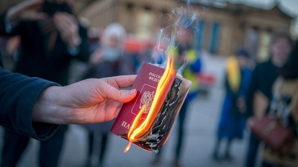 Russian passport on fire
