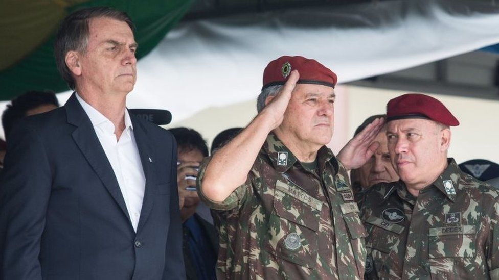 Jair Bolsonaro (L), is pictured during the graduation ceremony of new paratroopers at the Parachute Infantry Battalion, Vila Militar, in Rio de Janeiro, Brazil.