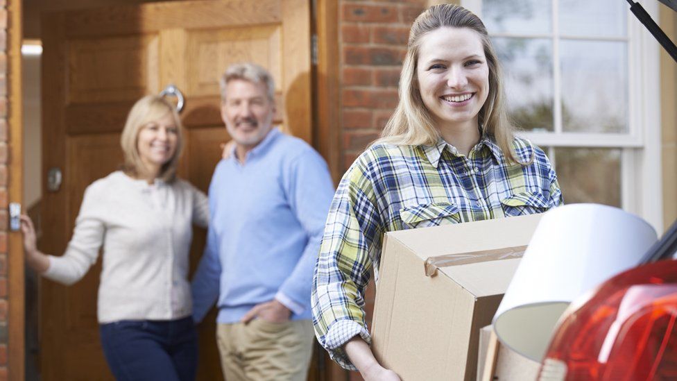 Young woman moving out of her parents' home