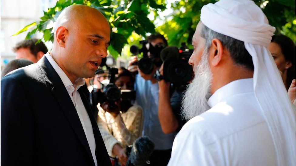 Britain's Communities and Local Government Secretary Sajid Javid speaks to a locals in the Finsbury Park area of north London