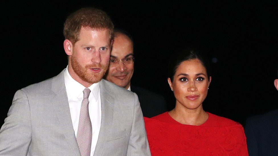 Prince Harry, Duke of Sussex (L) and his wife Meghan, Duchess of Sussex