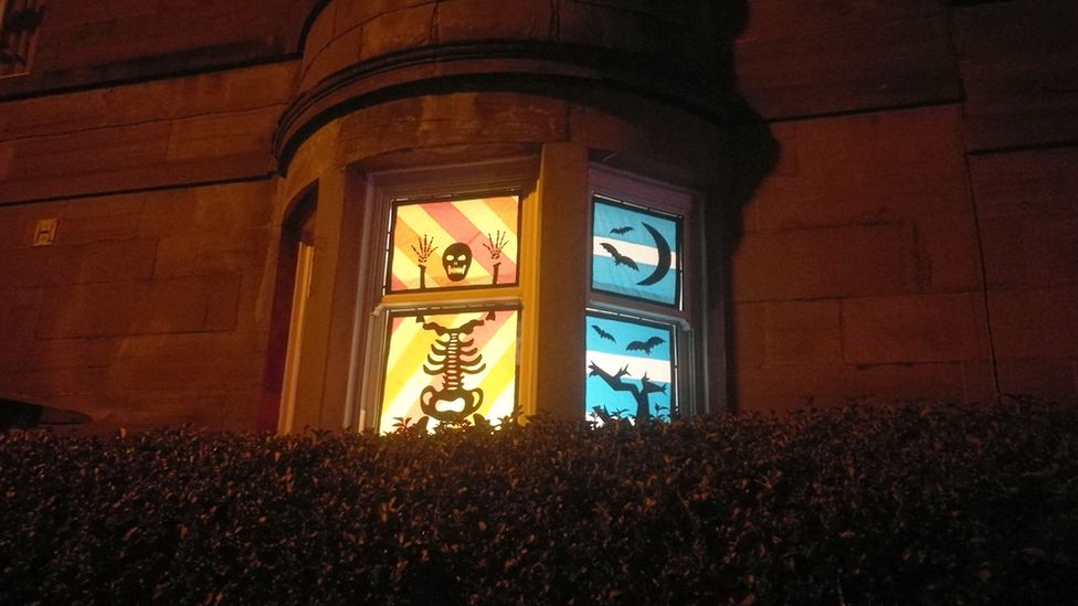 Skeleton figure in tenement window