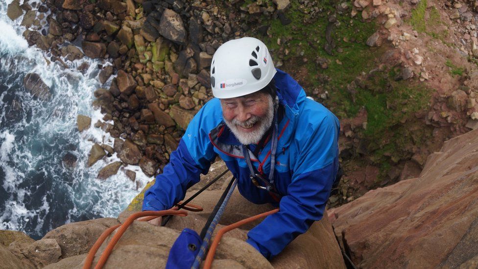 Chris Bonington climbing the Old Man of Hoy in 2014, to mark his 80th birthday