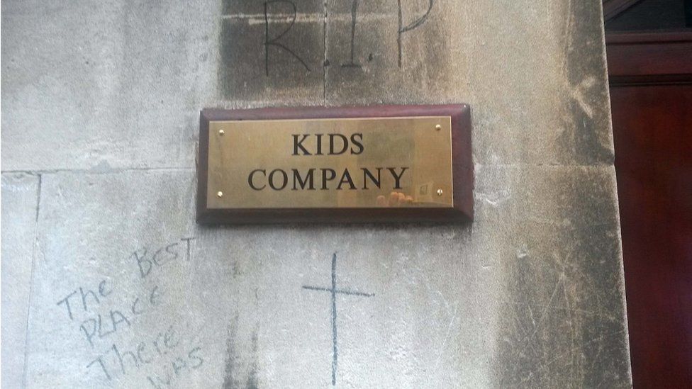 Name plate of Kids Company building in Bristol, with graffiti mourning its closure