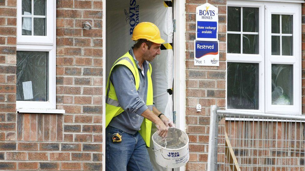 A worker at a Bovis home