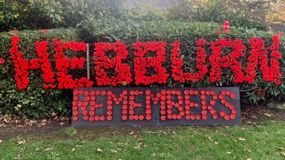 Hebburn Remembers sign made out of knitted red poppies