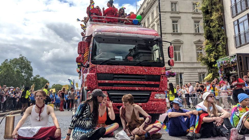 Protesters stopped in front of a Coca-Cola float in Piccadilly