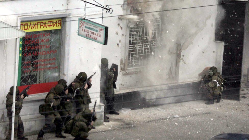 Russian special forces storm a shop in Nalchik, in 2005 where gunmen were holed-up following a deadly rampage the previous day
