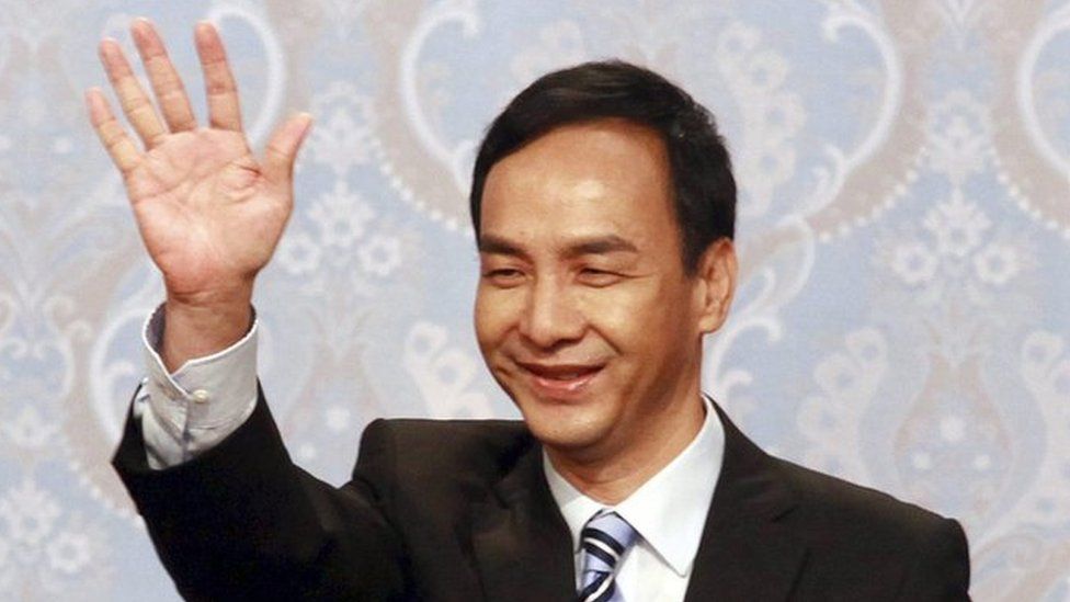 Taiwan's ruling KMT, or Nationalist Party, 2016 presidential candidate Eric Chu waves before attending his first televised policy debate with the Democratic Progressive Party, DPP, Tsai Ing-wen and People First Party's James Soong (both unseen), in Taipei, Taiwan, 27 December 2015.