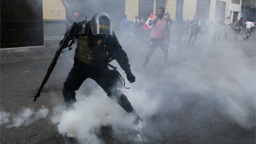 Protesters clash with police during a march after Peruvian President Pedro Pablo Kuczynski pardoned former President Alberto Fujimori in Lima, Peru. Photo: 25 December 2017