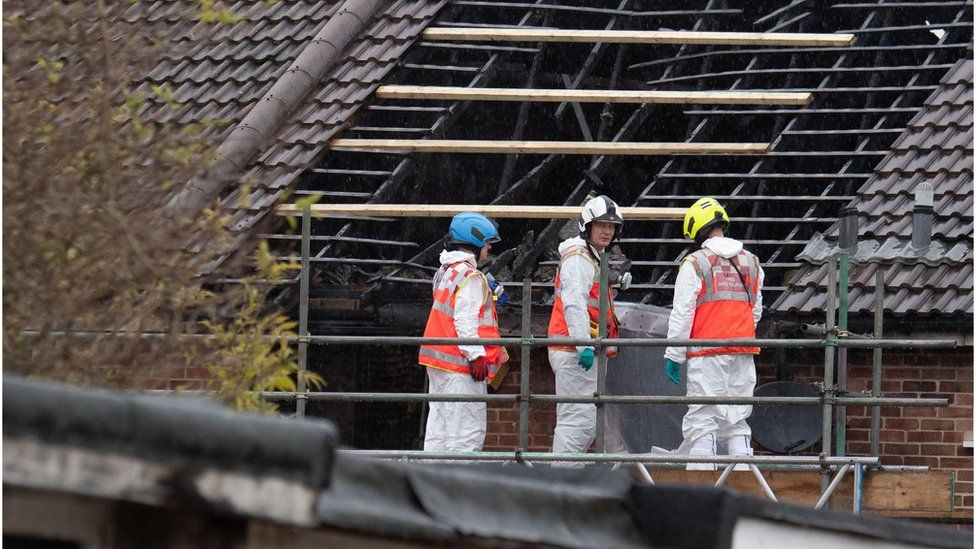 Forensics and fire investigators remain at the scene of a tragic fire that killed five people