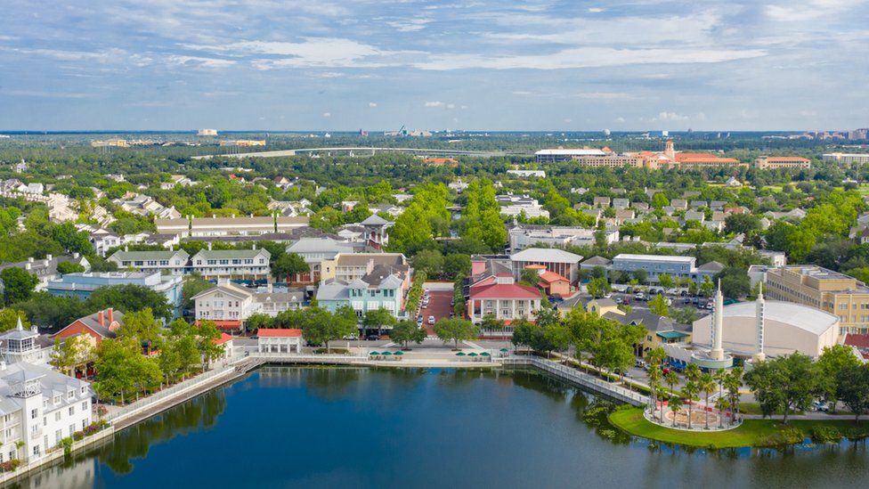 The idyllic town of Celebration, Florida, seen from the air, with Walt Disney World in the background
