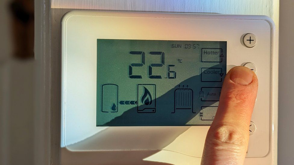 Finger turning down thermostat