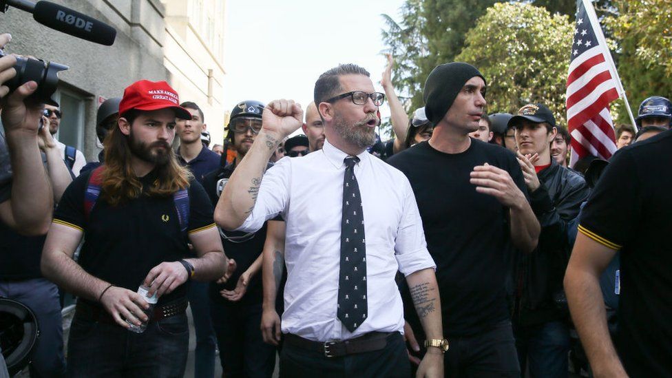 Vice co-founder Gavin McInnes (centre) pumps his fist during a rally in Berkeley, California.