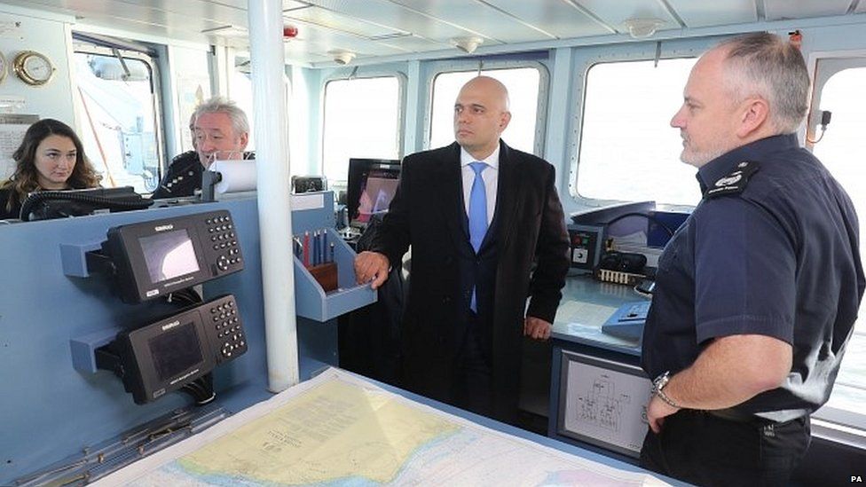 Sajid Javid speaks to the crew of HMC Searcher in the Dover Strait