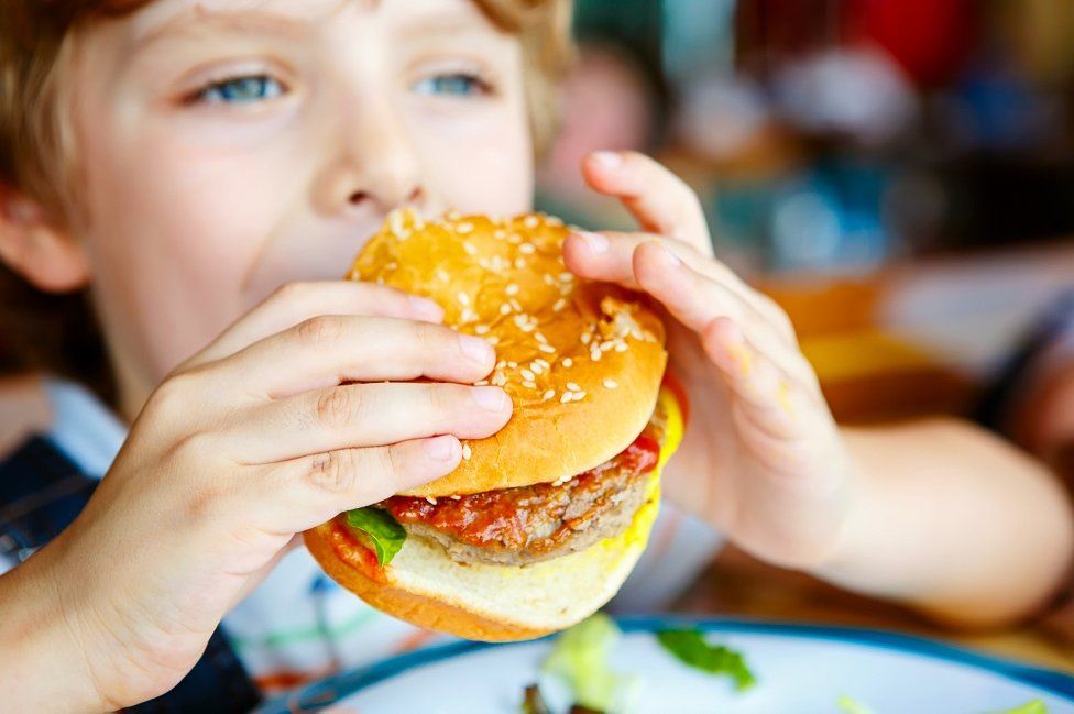 Child eating a burger