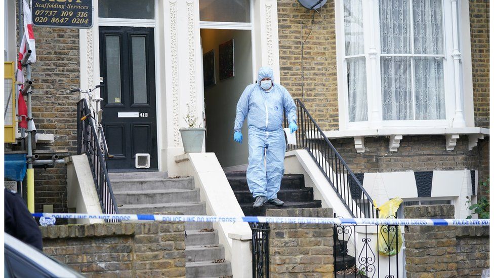 Forensic officers at a property on Montague Road in Dalston, Hackney, east London