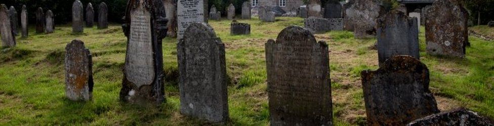 Gravestones in Dartmoor National Park, United Kingdom. Archive photo