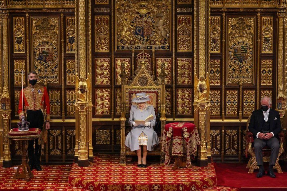 Queen Elizabeth II reads the Queen's Speech on the The Sovereign's Throne in the House of Lords chamber, during the State Opening of Parliament at the Houses of Parliament in London on 11 May 2021.