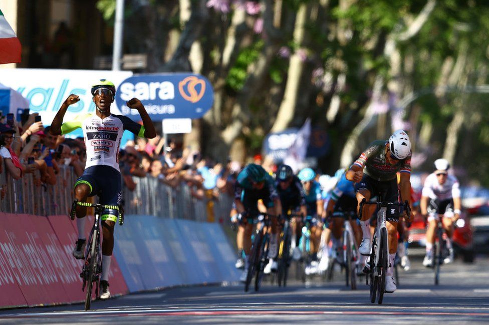 Hailu Biniam Girmay of Eritrea and Team Intermarché - Wanty - Gobert Matériaux celebrates at finish line as stage winner ahead of Mathieu Van Der Poel of Netherlands and Team Alpecin - Fenix during the 105th Giro d'Italia 2022, Stage 10 a 196km stage from Pescara to Jesi 95m / #Giro / #WorldTour / on May 17, 2022
