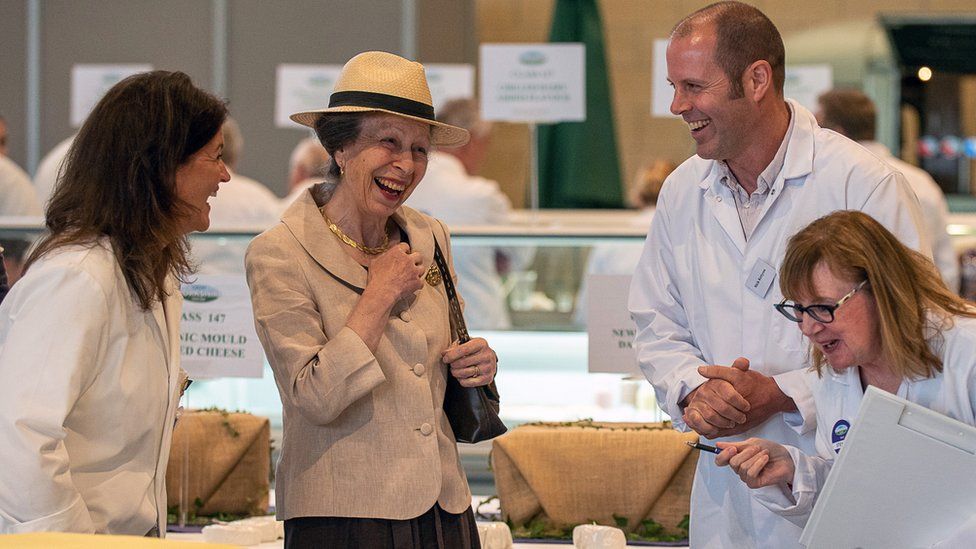 Princess Anne talking and laughing with food producers